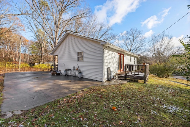 view of side of property with a deck