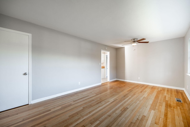 unfurnished room with ceiling fan and light hardwood / wood-style floors