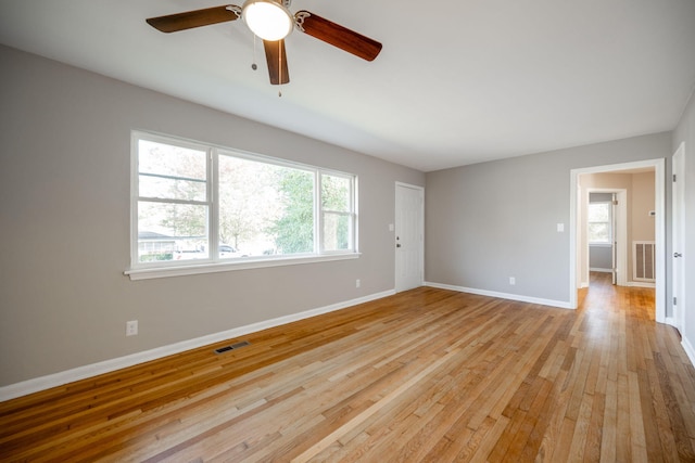 spare room featuring ceiling fan and light hardwood / wood-style floors