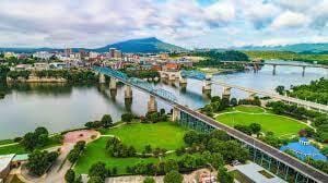 drone / aerial view featuring a water and mountain view