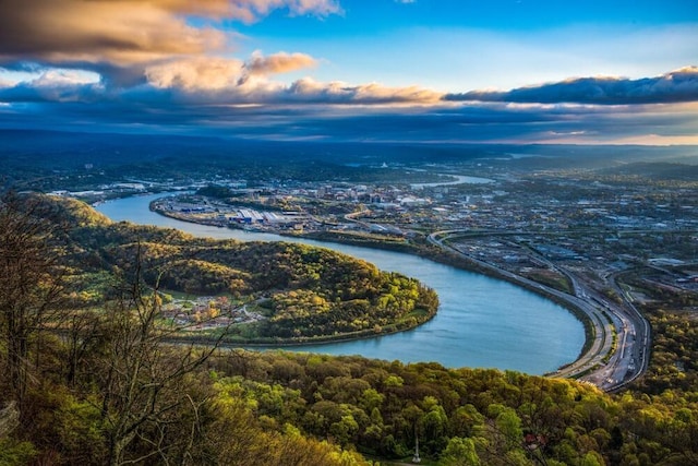 aerial view at dusk with a water view