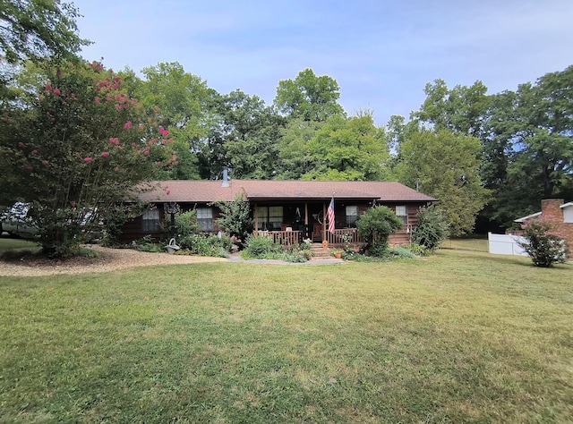 view of front facade with a front lawn and a porch