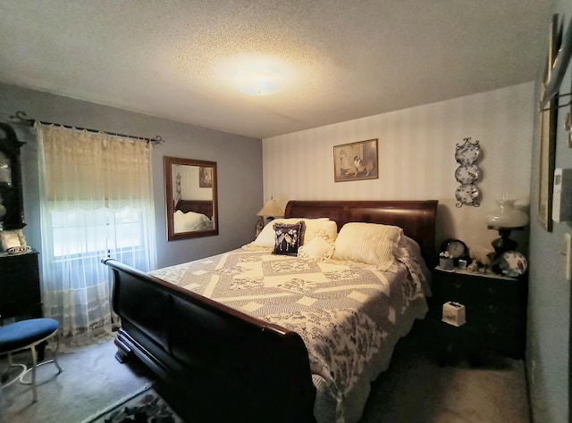 carpeted bedroom featuring a textured ceiling