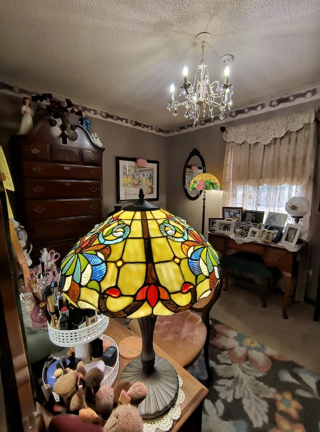 carpeted bedroom with a chandelier and a textured ceiling