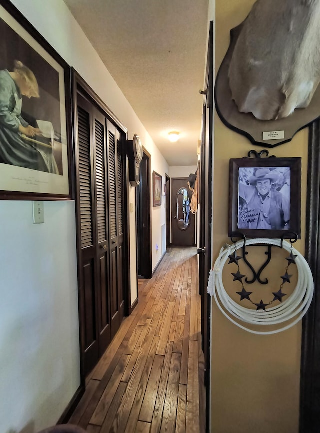 corridor featuring hardwood / wood-style floors