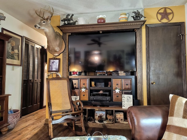 interior space featuring hardwood / wood-style floors and a textured ceiling