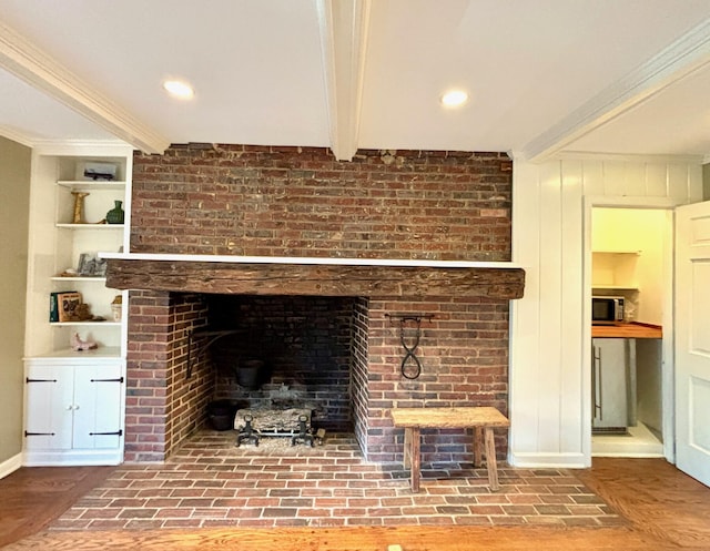 details featuring hardwood / wood-style flooring, built in features, ornamental molding, and beamed ceiling