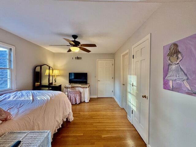 bedroom featuring ceiling fan and wood-type flooring