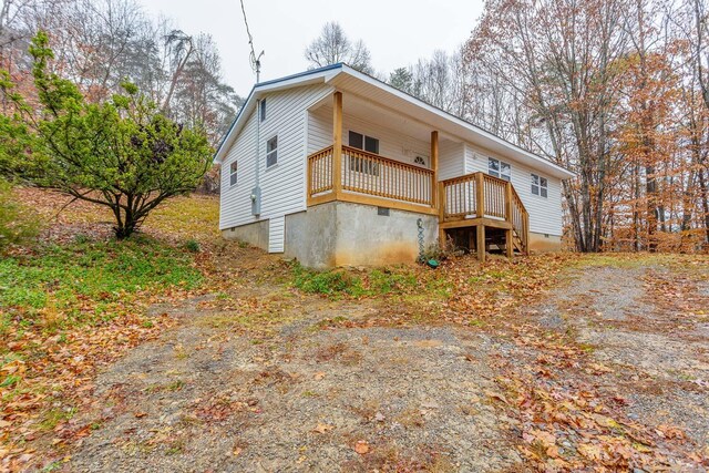 rear view of house with crawl space