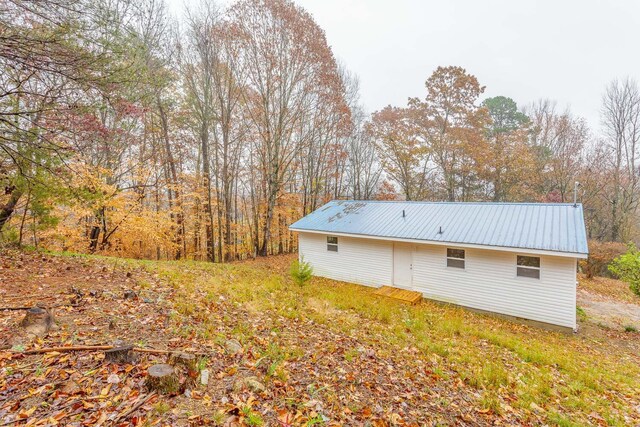 view of home's exterior with metal roof