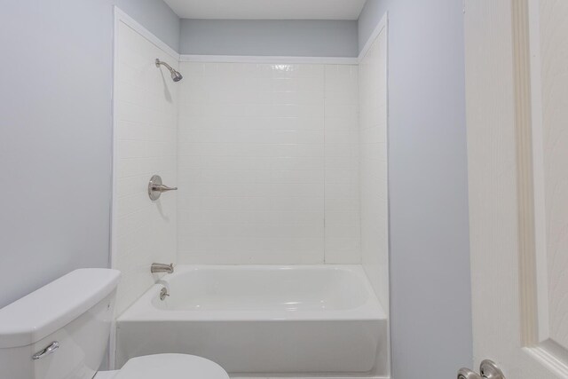 bathroom featuring  shower combination and toilet