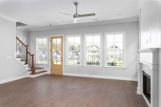 unfurnished living room with dark hardwood / wood-style floors, ceiling fan, and ornamental molding