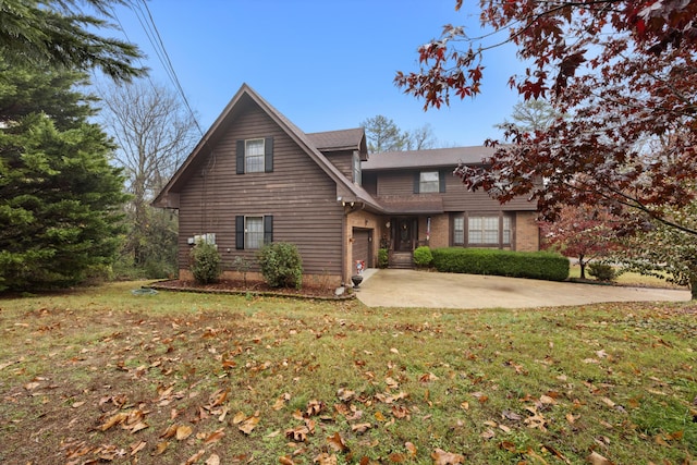 view of front facade featuring a front yard and a garage