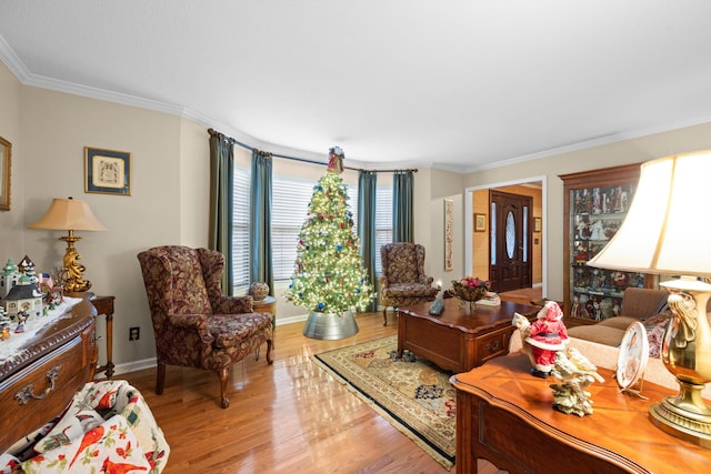 living room with light hardwood / wood-style floors and ornamental molding