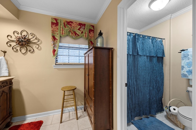 bathroom featuring a shower with curtain, tile patterned flooring, toilet, ornamental molding, and a textured ceiling