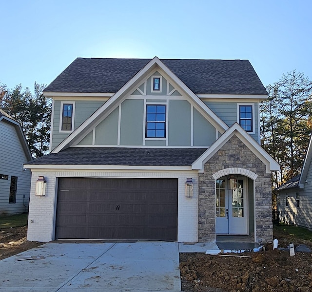 tudor home featuring a garage