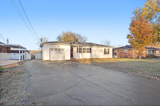 single story home featuring a garage and a front lawn