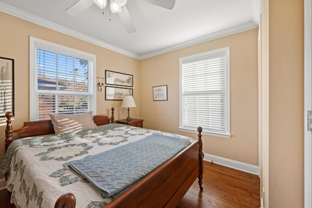 bedroom with wood-type flooring, ceiling fan, and crown molding