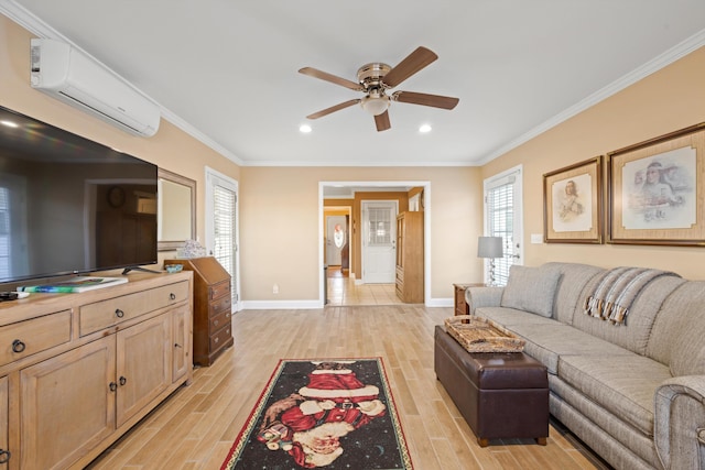 living room featuring a wall unit AC, ceiling fan, light hardwood / wood-style floors, and ornamental molding