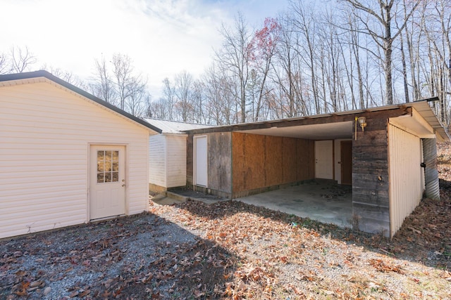 view of property exterior featuring a carport