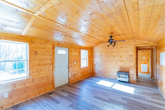 unfurnished living room featuring wood-type flooring, wood ceiling, and vaulted ceiling