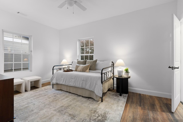 bedroom featuring dark hardwood / wood-style flooring and ceiling fan