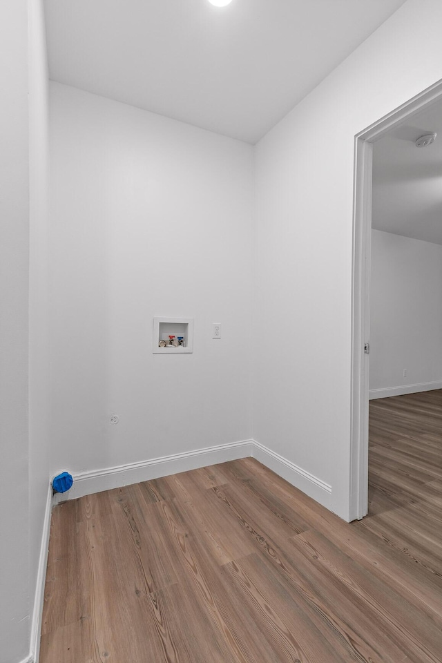 washroom featuring hardwood / wood-style floors and hookup for a washing machine