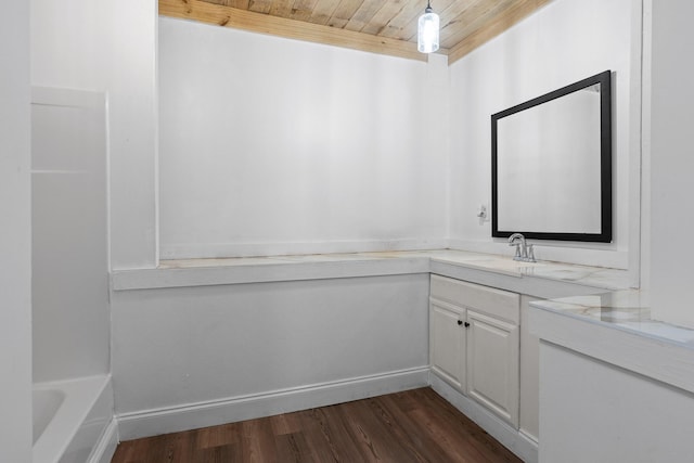 bathroom with a bathtub, vanity, wood ceiling, and hardwood / wood-style flooring