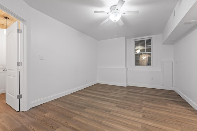 bonus room featuring ceiling fan and dark wood-type flooring