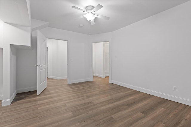 unfurnished bedroom featuring hardwood / wood-style flooring and ceiling fan