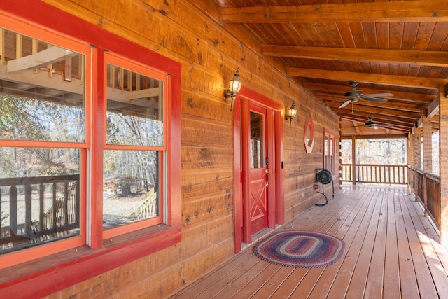 wooden deck with a porch and a ceiling fan