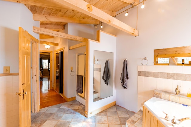 bathroom featuring a stall shower, lofted ceiling with beams, tile walls, wooden ceiling, and a bath