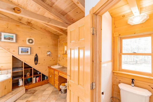 bathroom featuring wooden walls, wood ceiling, vaulted ceiling with beams, and toilet