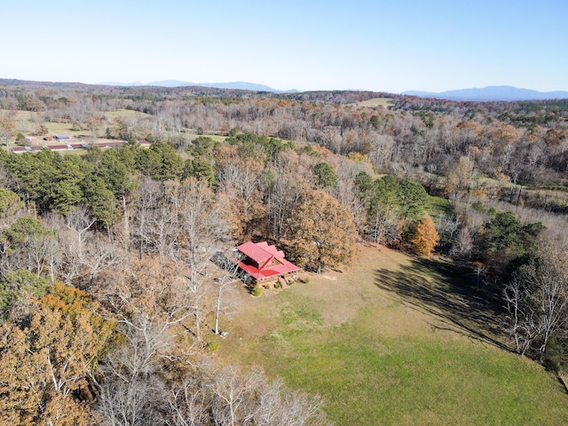 bird's eye view with a mountain view and a forest view