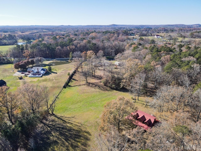 bird's eye view featuring a rural view and a forest view