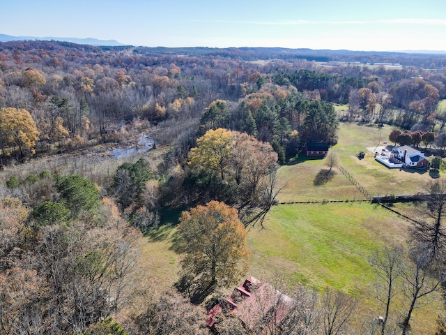 birds eye view of property with a wooded view