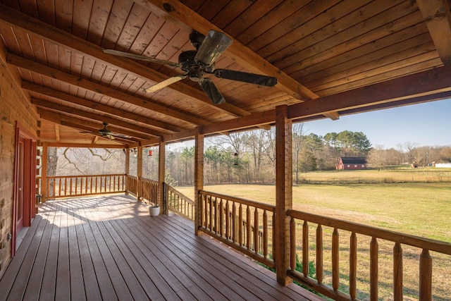 wooden terrace with a yard and a ceiling fan