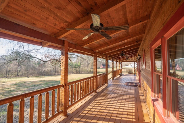 wooden terrace with a ceiling fan