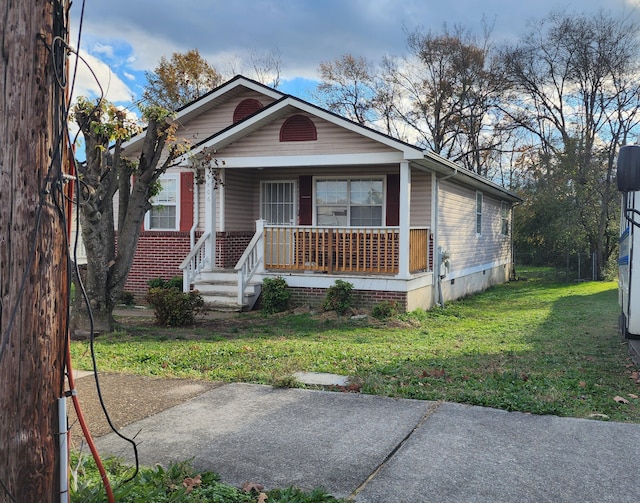 bungalow-style house featuring a front yard and a porch