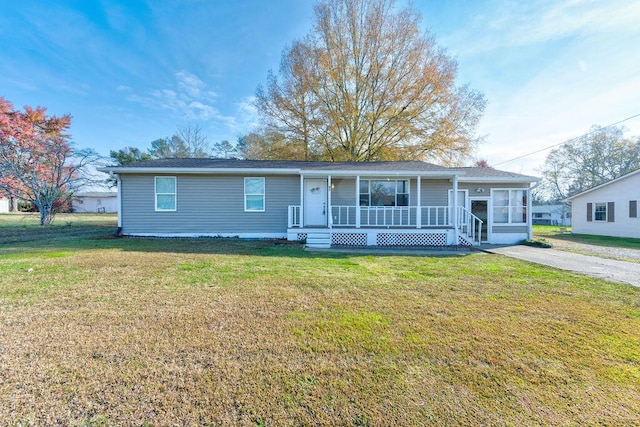 view of front facade with a front yard and a porch