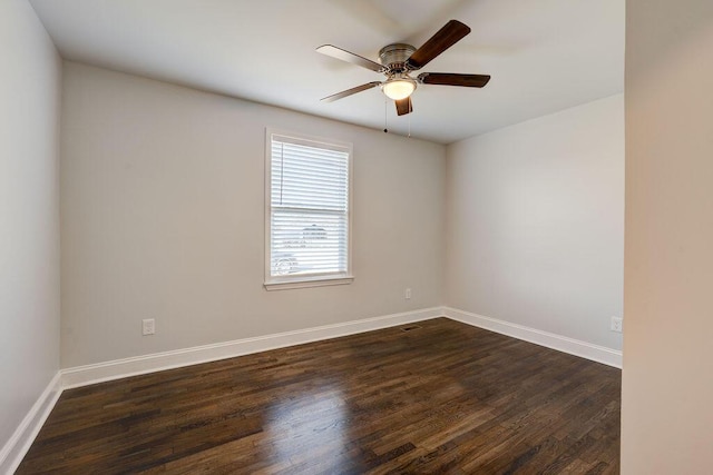 unfurnished room with ceiling fan and dark hardwood / wood-style flooring