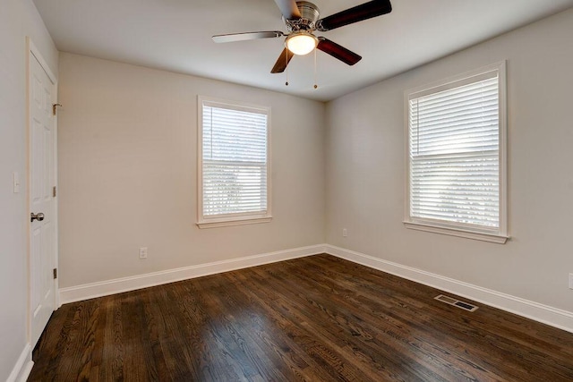 unfurnished room featuring dark hardwood / wood-style floors, plenty of natural light, and ceiling fan