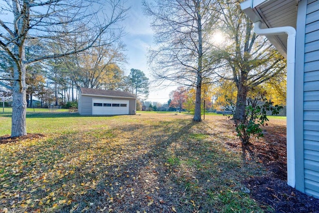 view of yard with an outbuilding and a garage