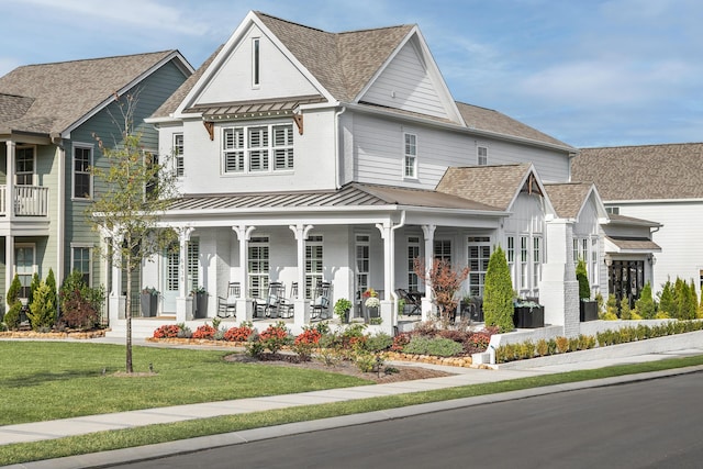 view of front of house with a front lawn and covered porch