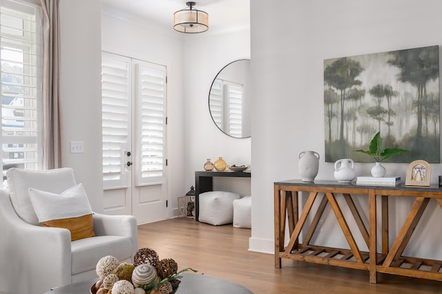 living area with hardwood / wood-style flooring