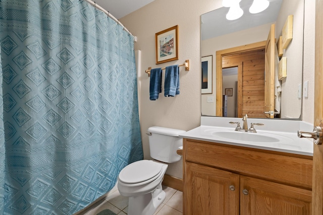 bathroom with tile patterned floors, vanity, curtained shower, and toilet