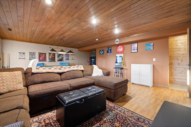 living room with ornamental molding, wood ceiling, and light wood-type flooring