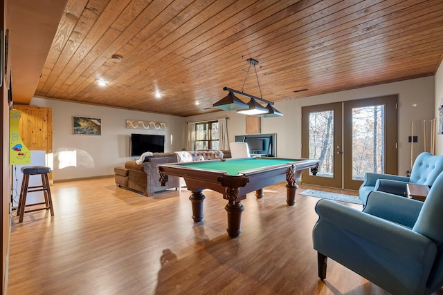 playroom with french doors, wood ceiling, light hardwood / wood-style flooring, a fireplace, and pool table