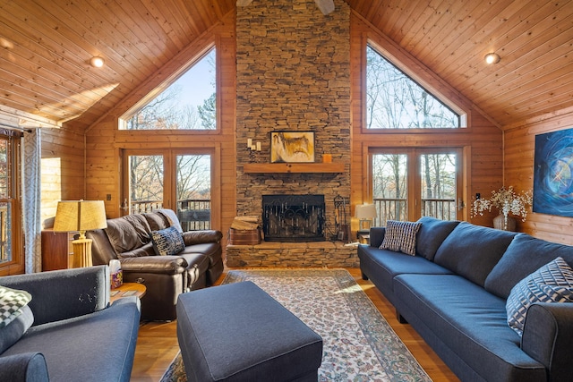 living room with hardwood / wood-style floors, wood ceiling, and high vaulted ceiling