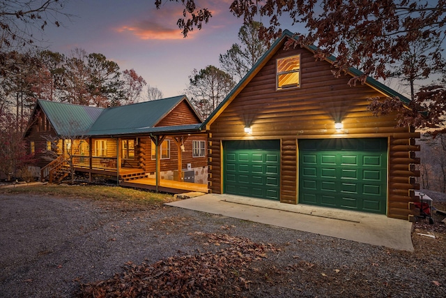 log home featuring a deck